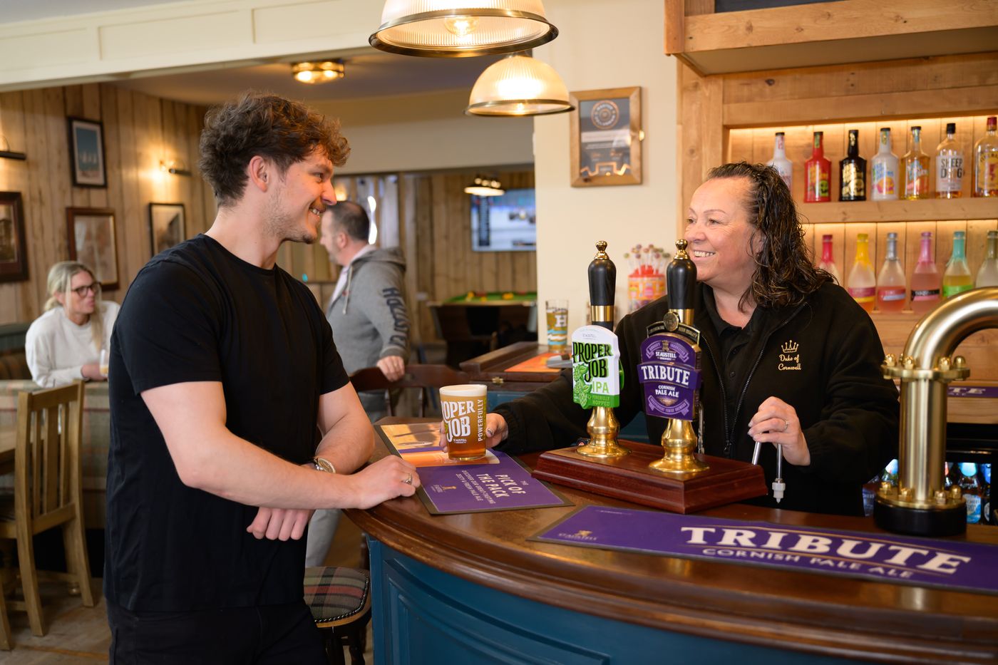 Being served at the bar — Tribute on the pumps