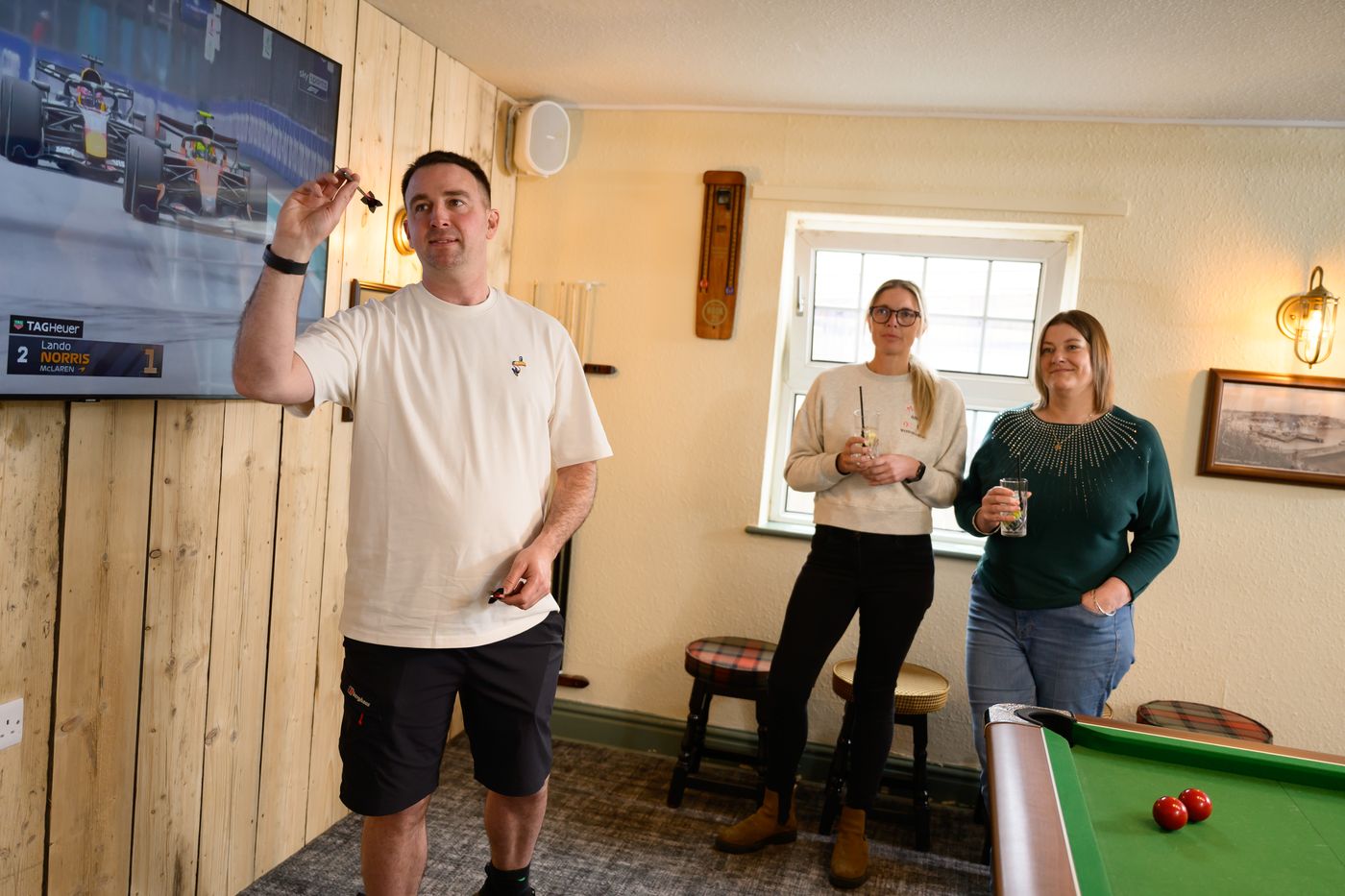 A game of darts in the games room