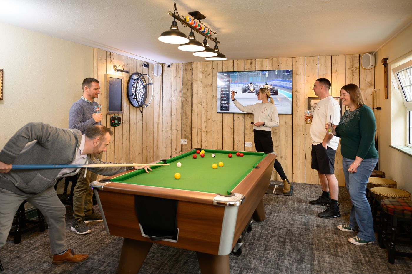 The games room — pool table and big screen